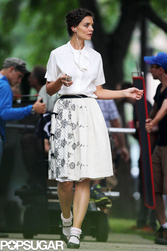 Katie Holmes took a break to listen to music and rock out on set.
Katie Holmes took a break to listen to music and rock out on set.
