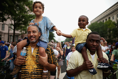 Two men and their sons marched together in Washington DC.
Two men and their sons marched together in Washington DC.