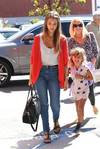 Jessica Alba rocked a pair of high-waisted jeans with a striped tank and a red cardigan in LA.
Jessica Alba rocked a pair of high-waisted jeans with a striped tank and a red cardigan in LA.