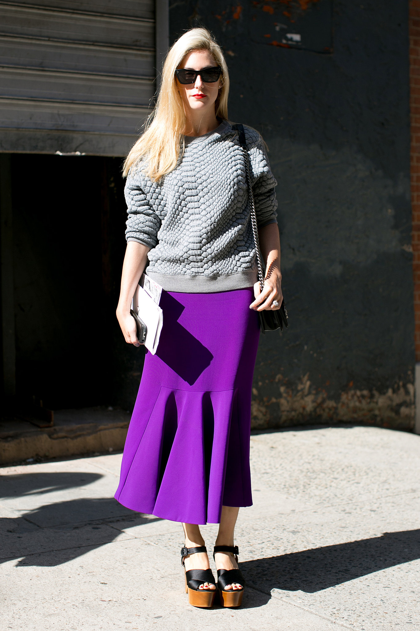 Joanna Hillman went sporty-meets-polished in a sweatshirt and flared skirt. 

