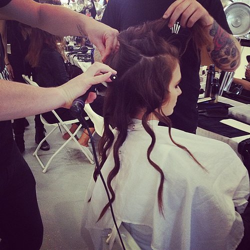 Stylists formed grungy waves in models' hair backstage at Rebecca Taylor.
Stylists formed grungy waves in models' hair backstage at Rebecca Taylor.
