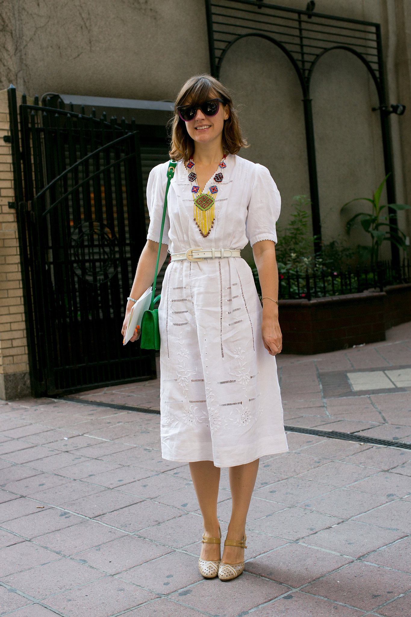 This showgoer dressed up a pretty white dress with bright add-ons. 
