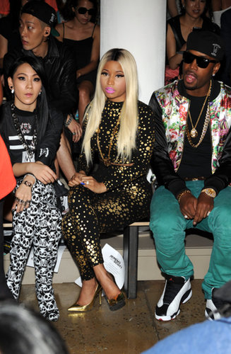 Nicki Minaj took the Jeremy Scott front row in a black- and gold-dotted jumpsuit and matching gold metallic pumps.
Nicki Minaj took the Jeremy Scott front row in a black- and gold-dotted jumpsuit and matching gold metallic pumps.