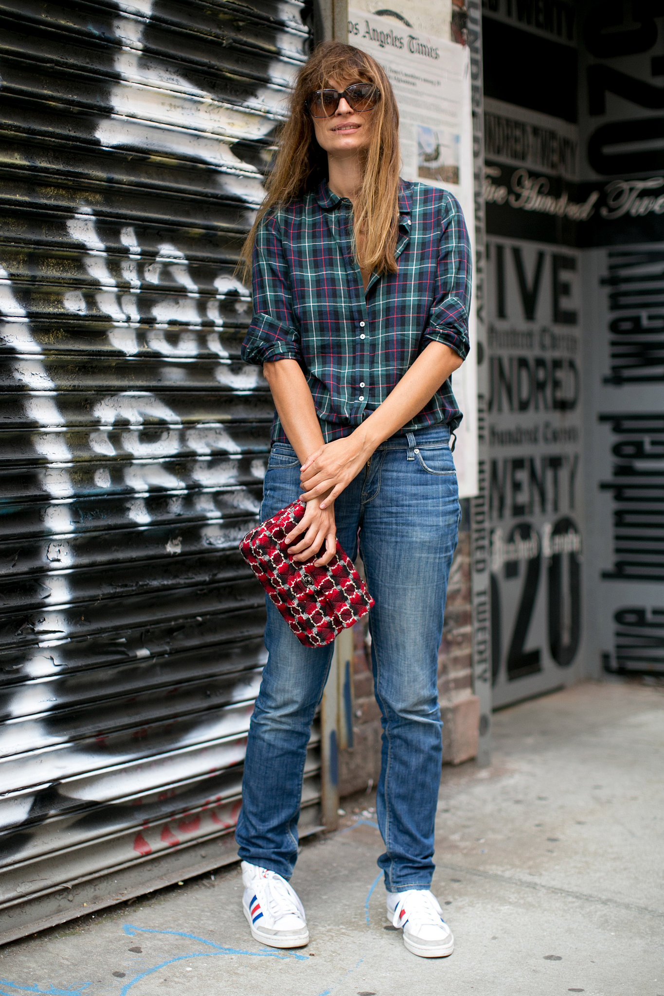 In plaid, sneakers, and denim, she gets our vote for one of the cutest casual looks at Fashion Week.
