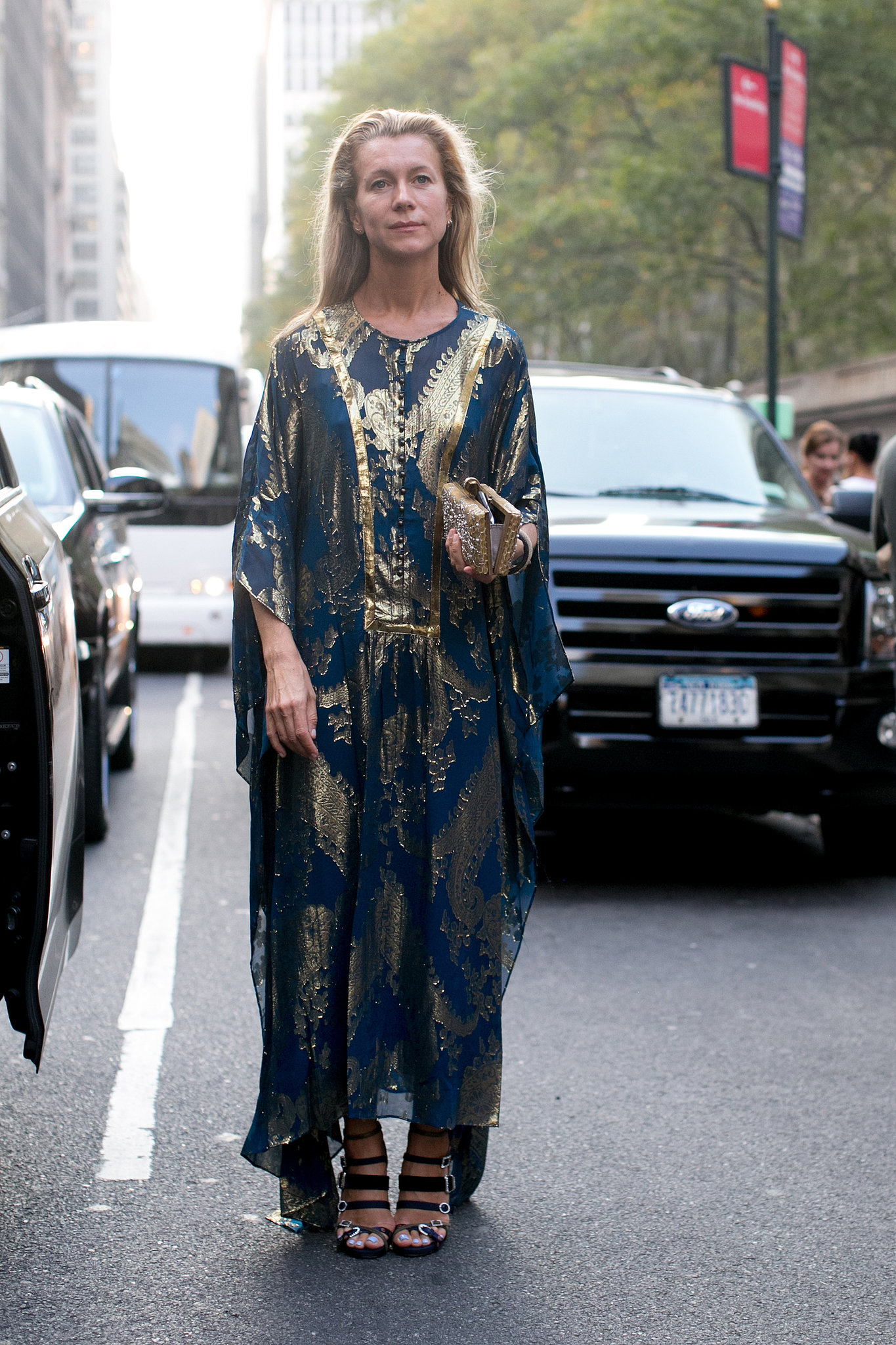 Natalie Joos dressed for the NYC heat wave in a gilded caftan. 

