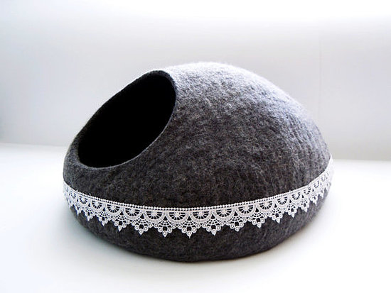 The lace detailing on this grey felted cat bed (from $64) takes it to the next level.
The lace detailing on this grey felted cat bed (from $64) takes it to the next level.