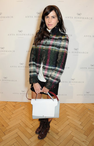 Caroline Sieber layered in a cozy plaid jacket at the Anya Hindmarch runway show.
Caroline Sieber layered in a cozy plaid jacket at the Anya Hindmarch runway show.