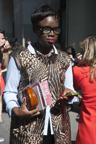 Eye-popping add-ons, like her necklace and wooden clutch, add to an already attention-getting animal print.
Eye-popping add-ons, like her necklace and wooden clutch, add to an already attention-getting animal print.