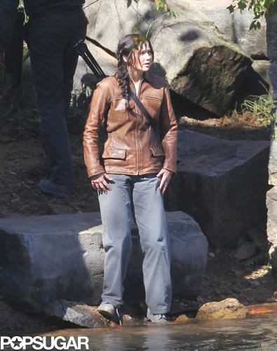 Jennifer Lawrence reprised her role as Katniss on the set of the third installment, Mockingjay.
Jennifer Lawrence reprised her role as Katniss on the set of the third installment, Mockingjay.