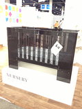 Nurseryworks' Vetro plexiglass crib will now be available in a darker color. 

