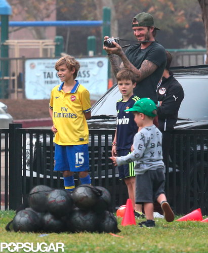 David Beckham and his boys watched Harper score a soccer goal.
David Beckham and his boys watched Harper score a soccer goal.