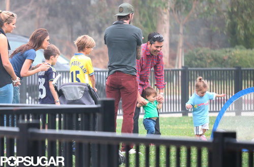 The Beckhams stood together to watch little Harper play soccer.
The Beckhams stood together to watch little Harper play soccer.