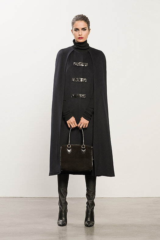 Wool Long Navy Cape With Snakeskin Detail ($1,495), Cashmere Black Turtleneck Sweater ($495), Sweet Revenge Black Leather Legging Boot ($1,995), Seductive Black Suede Satchel ($1,195)
Photo courtesy of Tamara Mellon
Wool Long Navy Cape With Snakeskin Detail ($1,495), Cashmere Black Turtleneck Sweater ($495), Sweet Revenge Black Leather Legging Boot ($1,995), Seductive Black Suede Satchel ($1,195)
Photo courtesy of Tamara Mellon