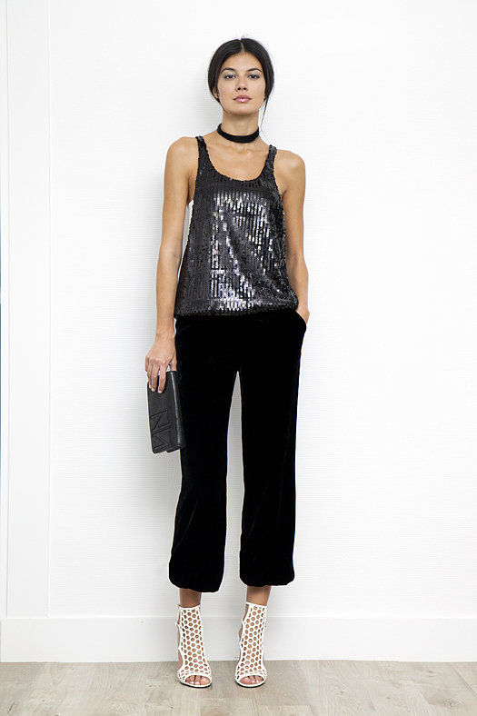 Sequin Low Side, High Neck Tank in Black ($395), Velvet Elastic Bottom Pant in Black ($695), Scandal Patent Sandal Bootie in Cream ($895), TM Enjoy Calf Clutch in Black ($495)
Photo courtesy of Tamara Mellon
Sequin Low Side, High Neck Tank in Black ($395), Velvet Elastic Bottom Pant in Black ($695), Scandal Patent Sandal Bootie in Cream ($895), TM Enjoy Calf Clutch in Black ($495)
Photo courtesy of Tamara Mellon