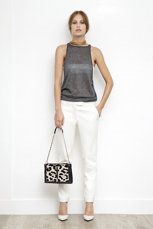 Lurex Low Side, High Neck Tank in Silver ($195), Leather Bandeau in Cream ($350), Slim Pant in Cream Wool ($595), Addiction Nappa Pump in Cream ($550), Attraction Pony Shoulder Bag in Grey/Cream Leopard ($1,995)
Photo courtesy of Tamara Mellon
Lurex Low Side, High Neck Tank in Silver ($195), Leather Bandeau in Cream ($350), Slim Pant in Cream Wool ($595), Addiction Nappa Pump in Cream ($550), Attraction Pony Shoulder Bag in Grey/Cream Leopard ($1,995)
Photo courtesy of Tamara Mellon