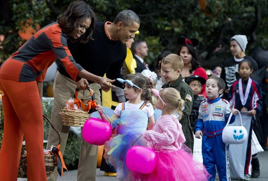 Michelle Obama and Barach Obama handed out candy to trick-or-treaters at the White House.
Michelle Obama and Barach Obama handed out candy to trick-or-treaters at the White House.