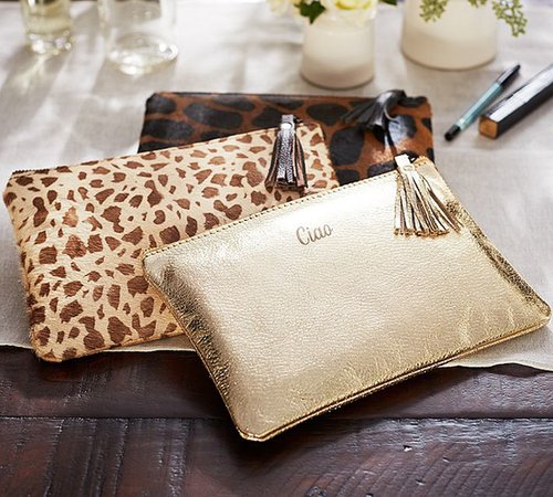 Amp up her makeup-bag game with this Gold Leather Travel Pouch ($39, $7 per monogram).
Amp up her makeup-bag game with this Gold Leather Travel Pouch ($39, $7 per monogram).