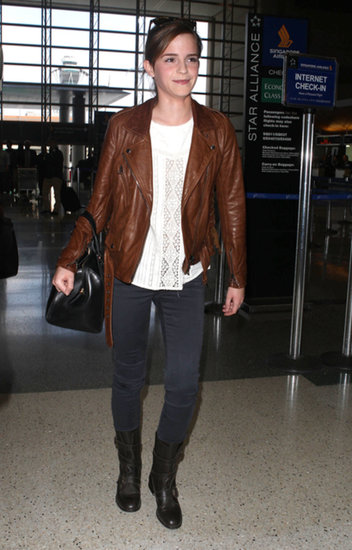 Emma Watson added edgy polish to her airport ensemble with the help of a brown motorcycle jacket and AG velvet jeans.
Emma Watson added edgy polish to her airport ensemble with the help of a brown motorcycle jacket and AG velvet jeans.