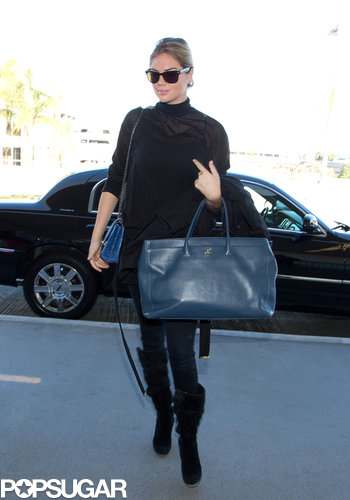 Kate Upton went with all black for her flight, leaning on that gorgeous blue Chanel carry-on for her single spot of color.
Kate Upton went with all black for her flight, leaning on that gorgeous blue Chanel carry-on for her single spot of color.