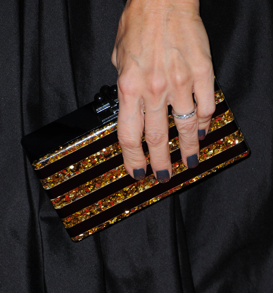 Monica Potter's striped Edie Parker clutch struck just the right note against her black and gold gown.
Monica Potter's striped Edie Parker clutch struck just the right note against her black and gold gown.