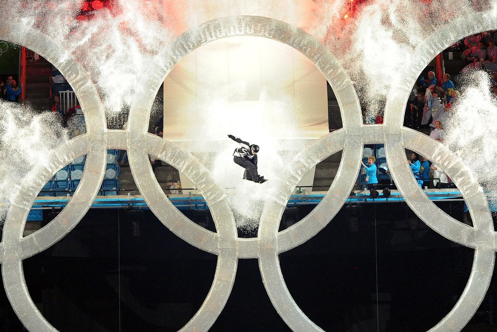 Then a snowboarder LEAPED through the Olympic rings. Then a snowboarder LEAPED through the Olympic rings.