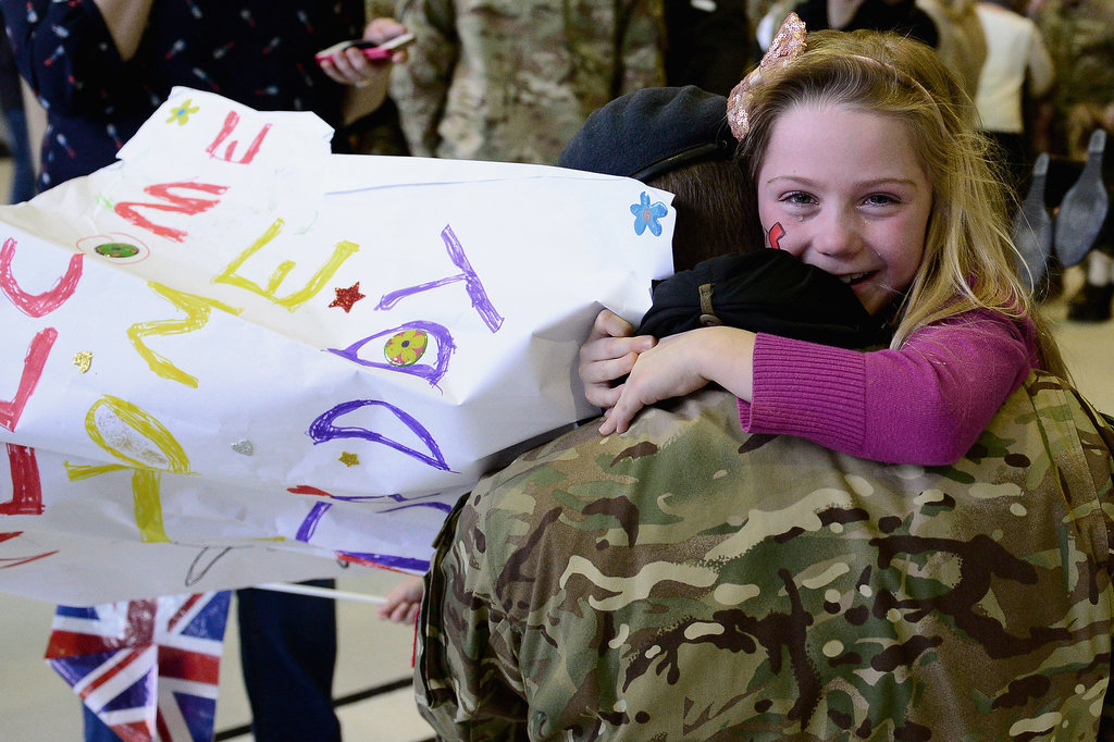 Seven-year-old Jessica hugged her dad, Flight Lt. Andy Power, when they were reunited. Seven-year-old Jessica hugged her dad, Flight Lt. Andy Power, when they were reunited.