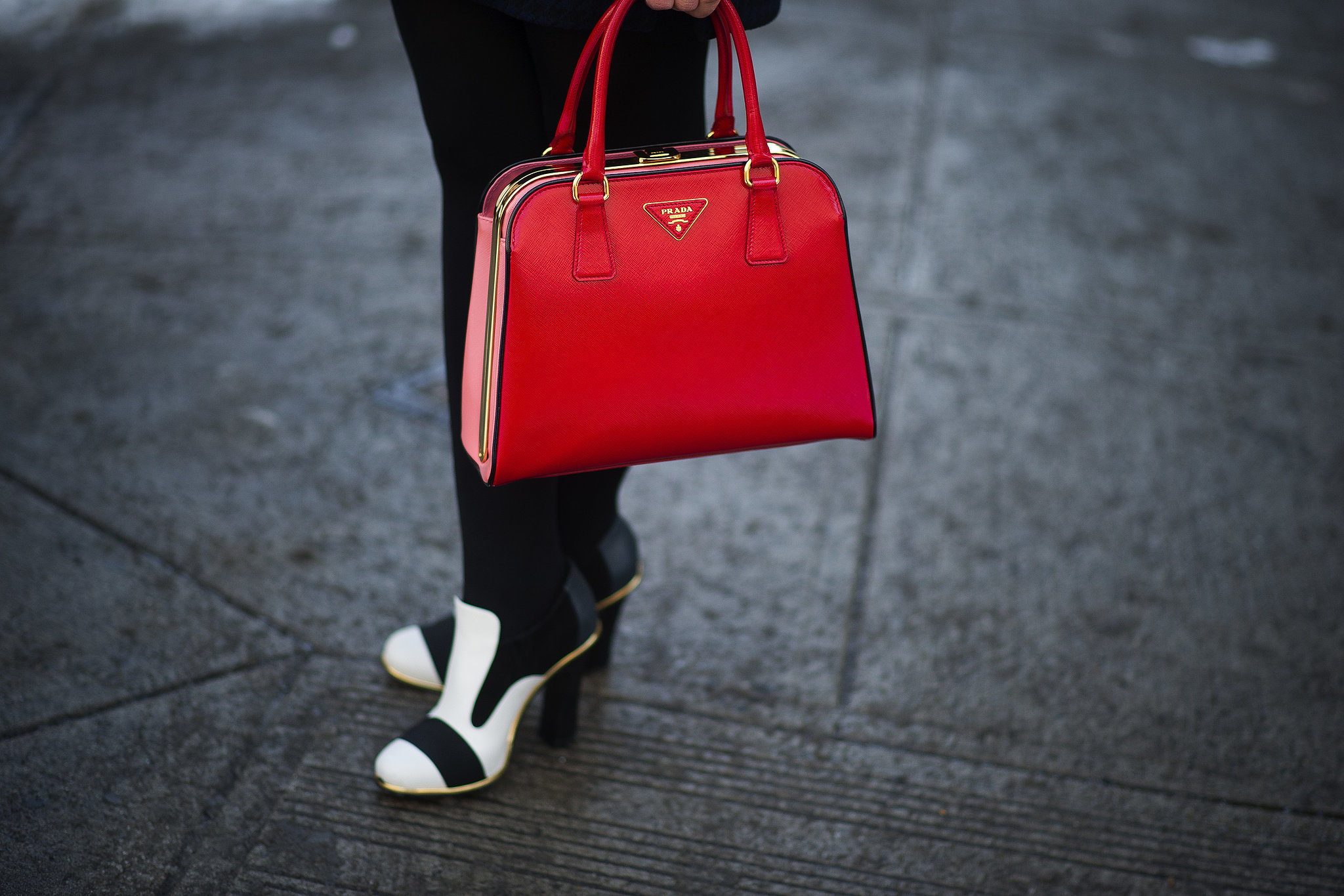 Red Prada met black and white heels. 
