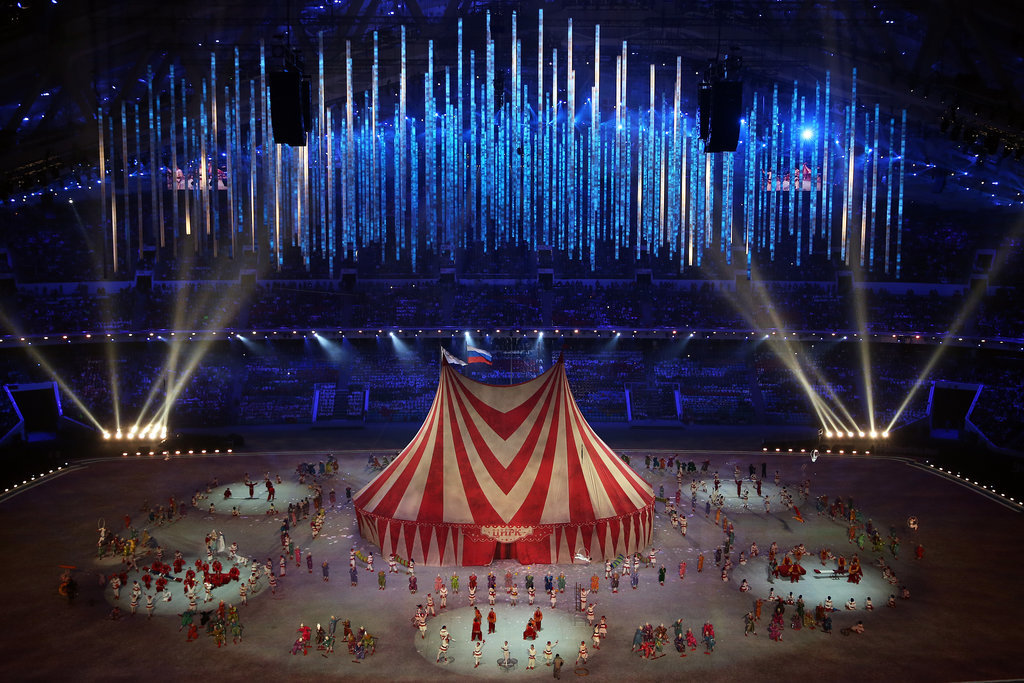 A giant red-and-white tent was brought in for a circus performance.
