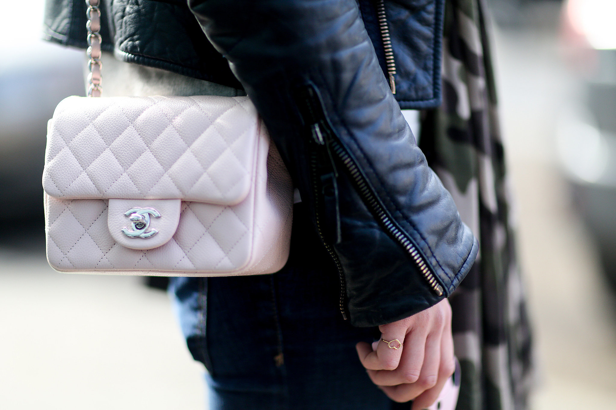 The prettiest counterpoint to a leather jacket is a petal-pink Chanel bag, don't you agree?
