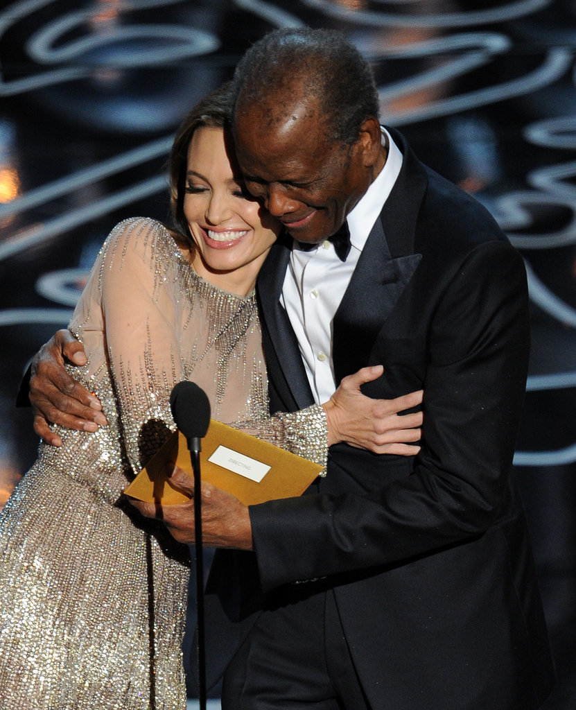 Angelina Jolie cuddled up to Sidney Poitier on stage as they presented the award for best director.
Angelina Jolie cuddled up to Sidney Poitier on stage as they presented the award for best director.