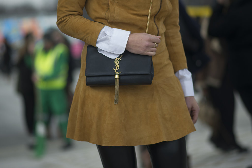 This black YSL bag and soft, camel suede team up for a perfectly polished look.
This black YSL bag and soft, camel suede team up for a perfectly polished look.