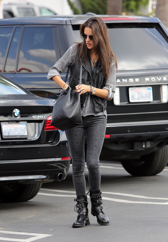 No high heels here! The model mom wore heavy buckled motorcycle boots and a leather vest while carrying a Mansur Gavriel bucket bag.
No high heels here! The model mom wore heavy buckled motorcycle boots and a leather vest while carrying a Mansur Gavriel bucket bag.