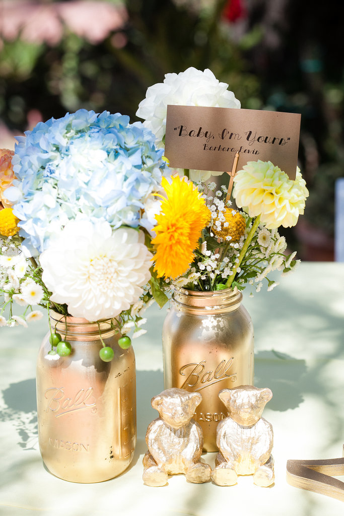Did you take on any DIY projects?
"We went spray-paint crazy. Mason jars, table figurines, table name holders, you name it — I think Home Depot started to get suspicious. We also hand-drew hearts onto matchbooks and enlisted the bridal party to tie them to sparklers, which we placed at each table setting for guests to light later in the evening. Chanti designed the menus and itineraries, and we printed them out at FedEx, where we took advantage of the sheet cutter (not something I would recommend when you're short on time!).
For favors, we bought miniature packets, which we decorated with cute kitten stamps (we have a cat hashtag on Instagram, #danteandcomma, so it seemed appropriate). We filled them with flower seeds, wrote 'California Paw-pies' on the front, and sealed them with a Golden Gate bridge stamp on the back."
Photo by G Aranow Photography
Did you take on any DIY projects?
"We went spray-paint crazy. Mason jars, table figurines, table name holders, you name it — I think Home Depot started to get suspicious. We also hand-drew hearts onto matchbooks and enlisted the bridal party to tie them to sparklers, which we placed at each table setting for guests to light later in the evening. Chanti designed the menus and itineraries, and we printed them out at FedEx, where we took advantage of the sheet cutter (not something I would recommend when you're short on time!).
For favors, we bought miniature packets, which we decorated with cute kitten stamps (we have a cat hashtag on Instagram, #danteandcomma, so it seemed appropriate). We filled them with flower seeds, wrote 'California Paw-pies' on the front, and sealed them with a Golden Gate bridge stamp on the back."
Photo by G Aranow Photography