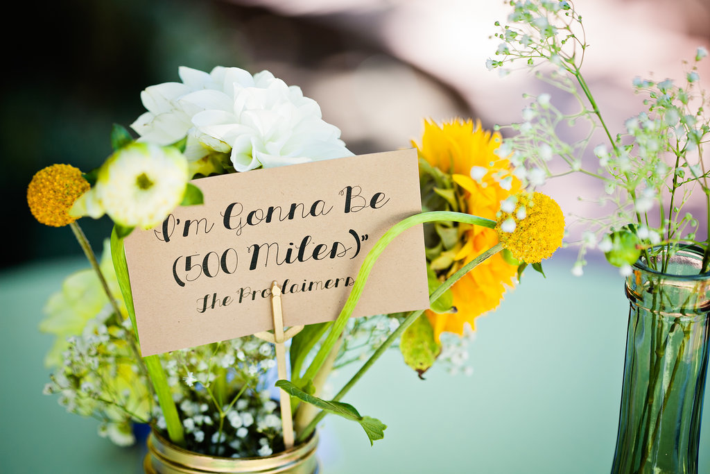 "The table name cards were also DIY — we picked the names of some of our favorite love songs. It was extra fun to then add those songs to the playlist and let every table get their own little 'shout-out.' All the flowers were hand-picked by us, too. We picked them up at the San Francisco Flower Mart the morning before the wedding, and man, my car will never smell that good again! Our only real decorative 'splurges' were the piñatas, which we ordered online, and the hand-cut papel picado, which we bought on Valencia Street."
Photo by G Aranow Photography
"The table name cards were also DIY — we picked the names of some of our favorite love songs. It was extra fun to then add those songs to the playlist and let every table get their own little 'shout-out.' All the flowers were hand-picked by us, too. We picked them up at the San Francisco Flower Mart the morning before the wedding, and man, my car will never smell that good again! Our only real decorative 'splurges' were the piñatas, which we ordered online, and the hand-cut papel picado, which we bought on Valencia Street."
Photo by G Aranow Photography