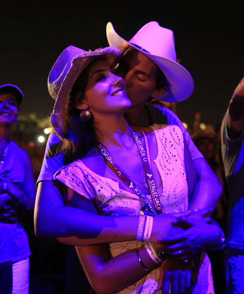 Two lovebirds embraced at Stagecoach.
Two lovebirds embraced at Stagecoach.