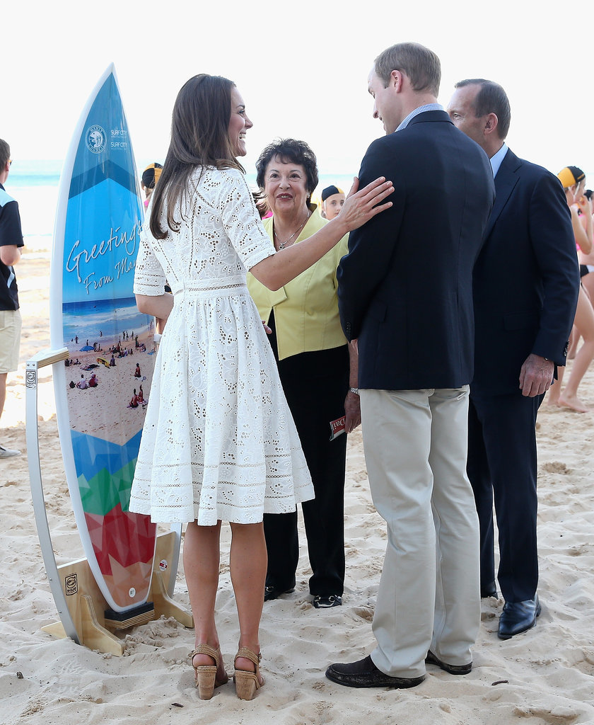 Catherine put her hand on her husband as they were presented with a surfboard on Sydney's Manley Beach during their 2014 tour of the country.
Catherine put her hand on her husband as they were presented with a surfboard on Sydney's Manley Beach during their 2014 tour of the country.