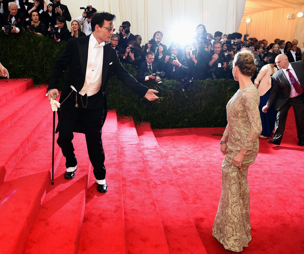Johnny Depp lent a hand to Amber Heard as they headed up the stairs.
Johnny Depp lent a hand to Amber Heard as they headed up the stairs.