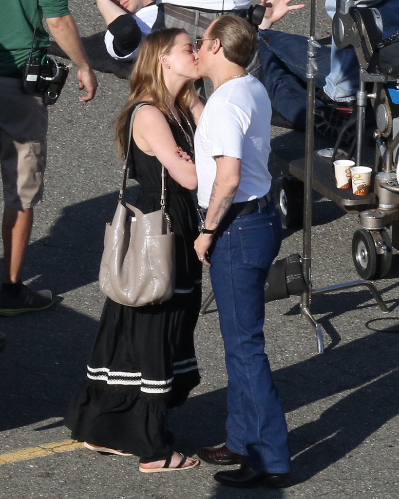 Johnny Depp and Amber Heard packed on the PDA on his Black Mass set in Boston on Monday.
Johnny Depp and Amber Heard packed on the PDA on his Black Mass set in Boston on Monday.