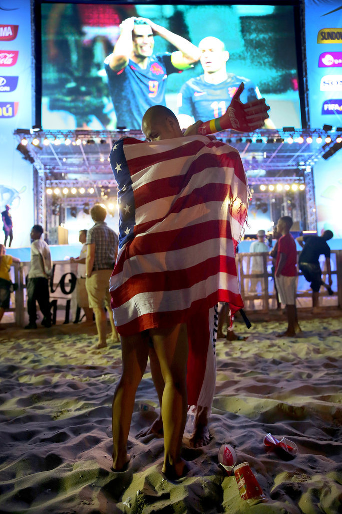 A couple kissed with the American flag wrapped around them while watching a game in Rio de Janeiro, Brazil.
A couple kissed with the American flag wrapped around them while watching a game in Rio de Janeiro, Brazil.