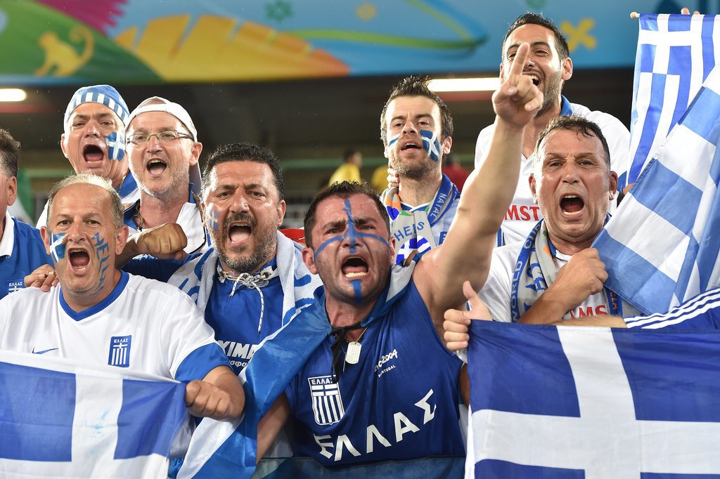 In Brazil, Greece fans held up flags and cheered ahead of the game against Japan.
In Brazil, Greece fans held up flags and cheered ahead of the game against Japan.