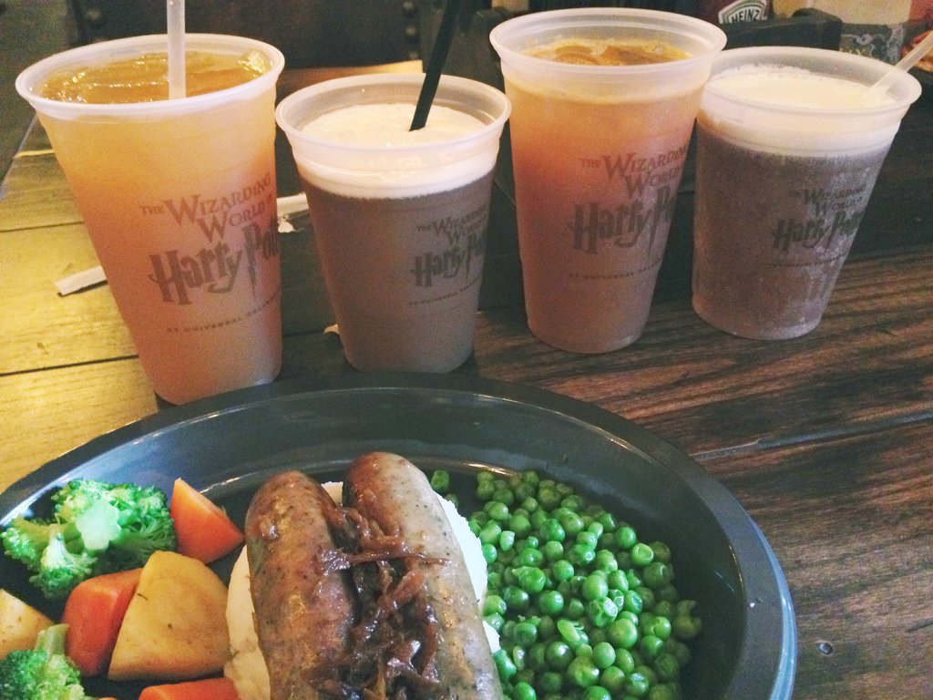 I tasted the new edible offerings at The Leaky Cauldron, and both the fish and chips and the bangers and mash were quite tasty. I also sipped my way through all the beverages offered, including the Fishy Green Ale, a green mint tea drink with "fish eggs" aka boba-sized blueberry juice-filled balls (I wasn't a fan).
I tasted the new edible offerings at The Leaky Cauldron, and both the fish and chips and the bangers and mash were quite tasty. I also sipped my way through all the beverages offered, including the Fishy Green Ale, a green mint tea drink with "fish eggs" aka boba-sized blueberry juice-filled balls (I wasn't a fan).