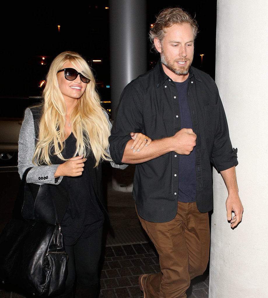 Jessica held on to her man as they made their way through LAX in November 2013.
Jessica held on to her man as they made their way through LAX in November 2013.