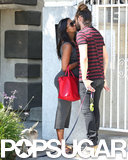 Pregnant Zoe Saldana Seals Her Saturday With a Romantic Kiss