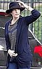 Liv Tyler Wears Navy Cardigan and Hat in WIndy New York City