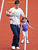 Katie Holmes and Suri Running On a Track