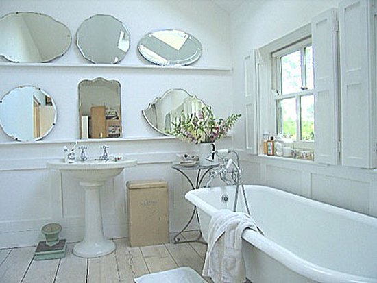 Two shelves host an arrangement of mirrors that reflect light beautifully in this bright bathroom.
Source
Two shelves host an arrangement of mirrors that reflect light beautifully in this bright bathroom.
Source