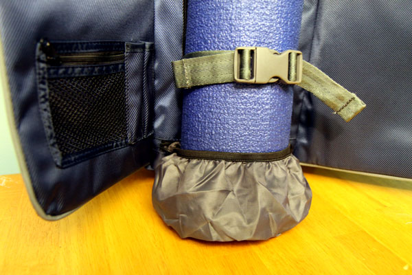 Inside of backpack, showing elastic mat protector Inside of backpack, showing elastic mat protector