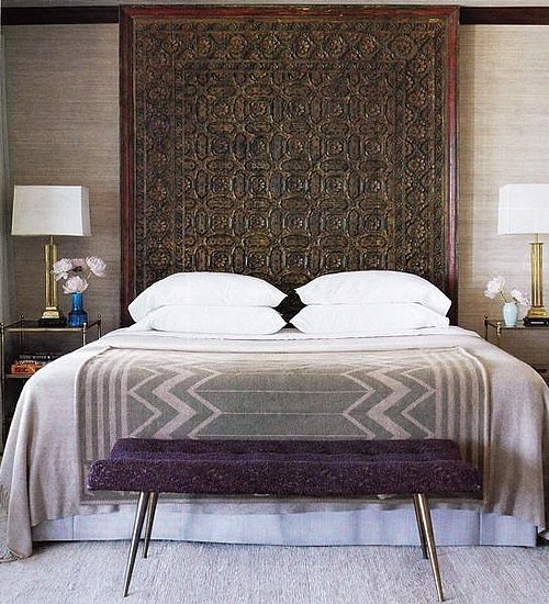An intricate brown headboard offers a grounding influence in this eclectic, textured bedroom.
Source
An intricate brown headboard offers a grounding influence in this eclectic, textured bedroom.
Source