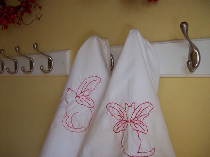 For something a little different, add these Angel Kitty Tea Towels ($12 for two), featuring hand embroidered designs in red.
For something a little different, add these Angel Kitty Tea Towels ($12 for two), featuring hand embroidered designs in red.