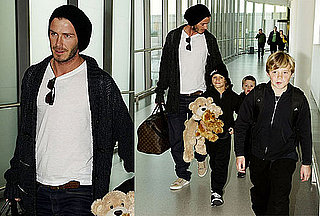 Photos of David Beckham, Romeo Beckham, Brooklyn Beckham, And Cruz Beckham at Heathrow